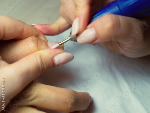 Perfect nails manicure process. Hardware manicure
