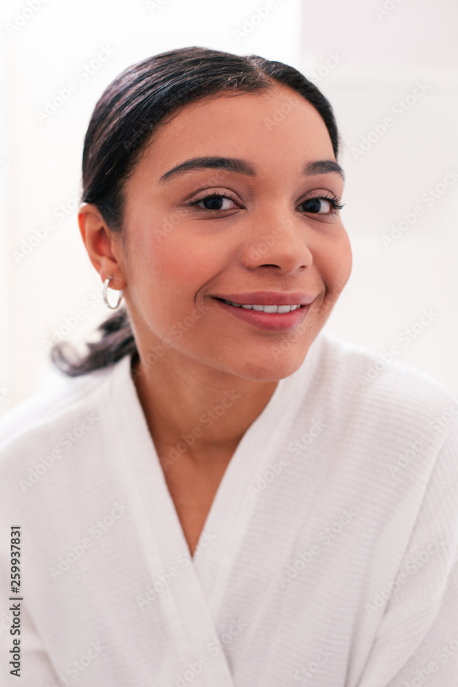 Beautiful dark haired woman posing for photo and smiling Beautiful dark haired woman posing for photo and smiling