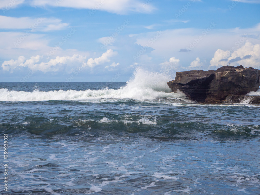 Beach Waves beat on the stone. Bali