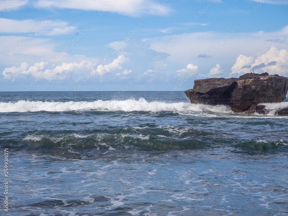 Beach Waves beat on the stone. Bali