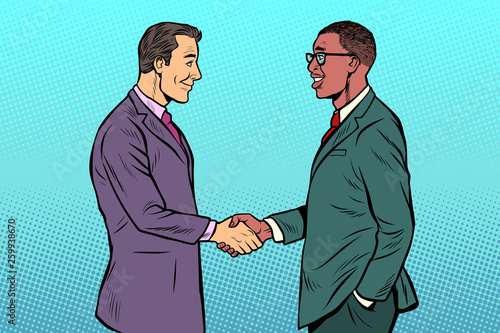 African and Caucasian businessmen men handshake