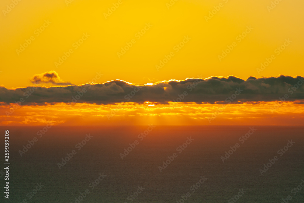 spectacular sunset over the sea with clouds