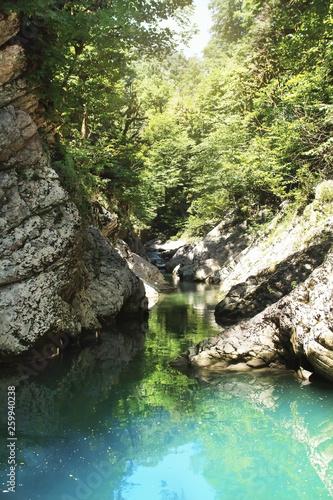 Wet Canyon of River Psakho. Mountain river with blue water. Sochi, Russia.