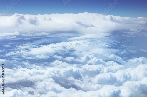 Fototapeta Naklejka Na Ścianę i Meble -  View from plane window. Beautiful sky landscape with cumulus clouds