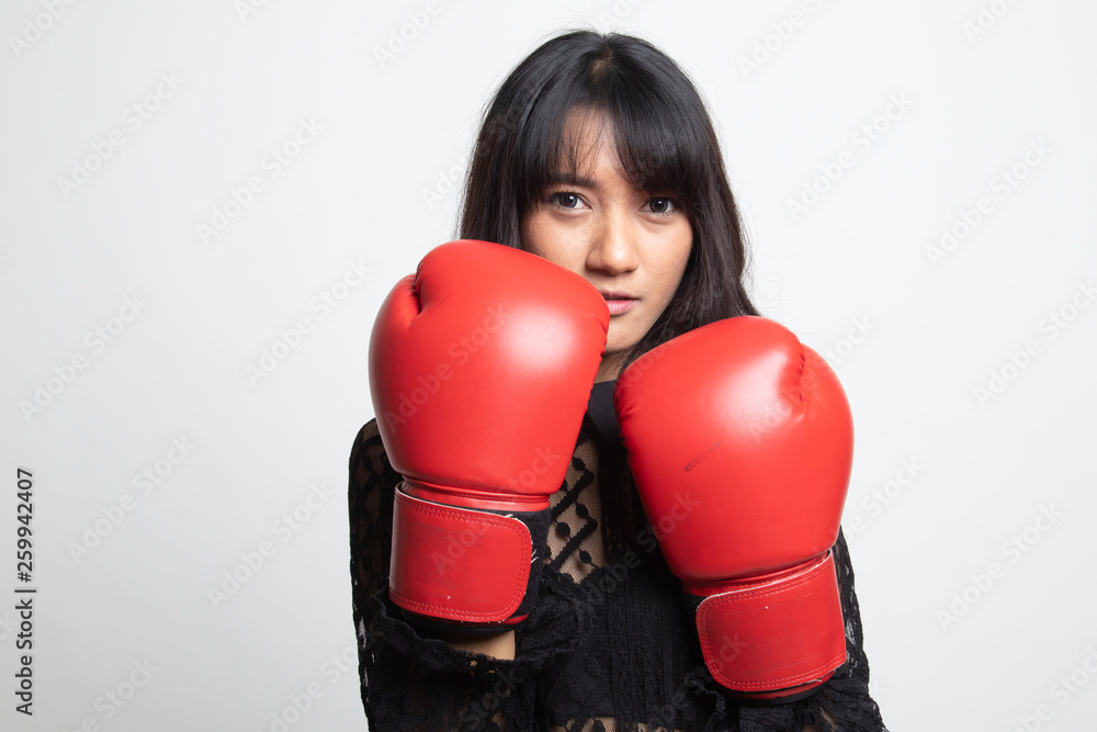 Young Asian woman with red boxing gloves. Young Asian woman with red boxing gloves.