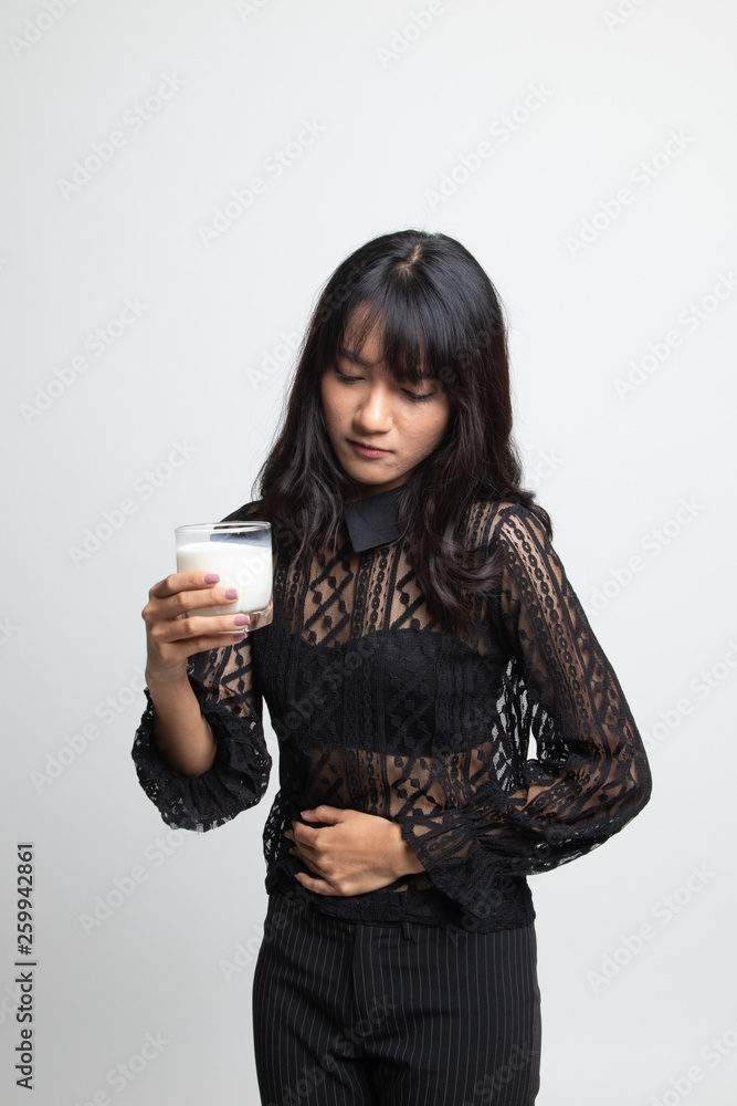 Asian woman drinking a glass of milk got stomachache. Asian woman drinking a glass of milk got stomachache.