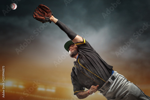 Cuadro en lienzo Professional baseball player in action on grand arena in evening during a game