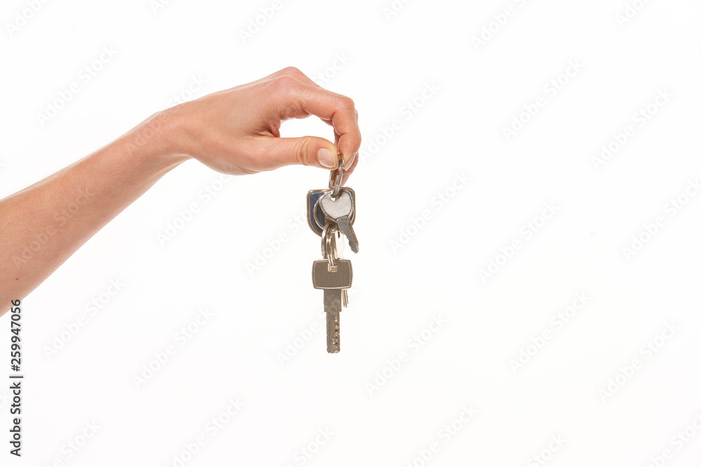 hand holding key isolated on white background hand holding key isolated on white background