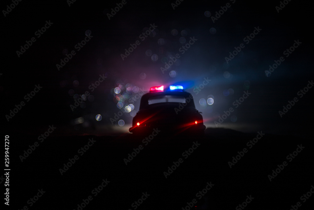 Police cars at night. Police car chasing a car at night with fog background. 911 Emergency response Police cars at night. Police car chasing a car at night with fog background. 911 Emergency response