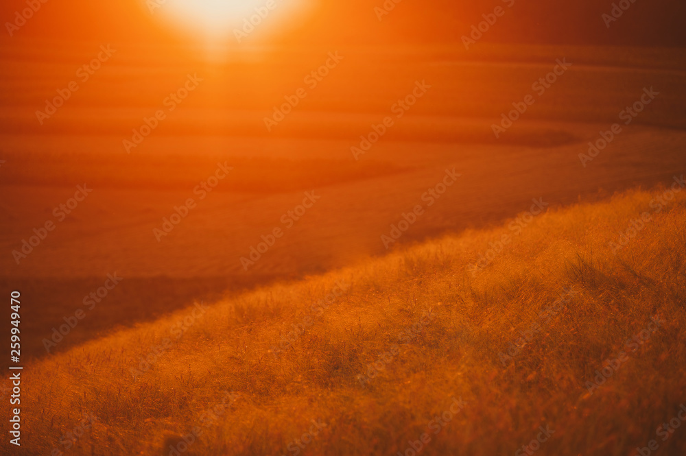 Photo of colorful sunset on the top of the hills