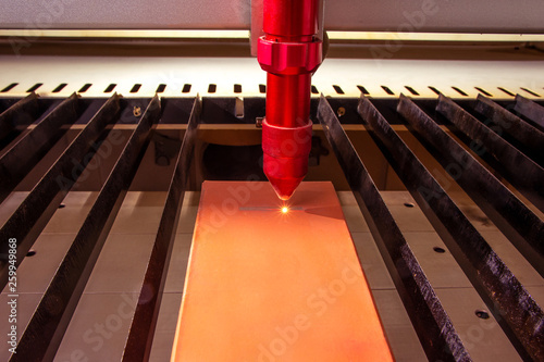 Obraz na płótnie Closeup laser engraver working and engraving flat ceramic stone