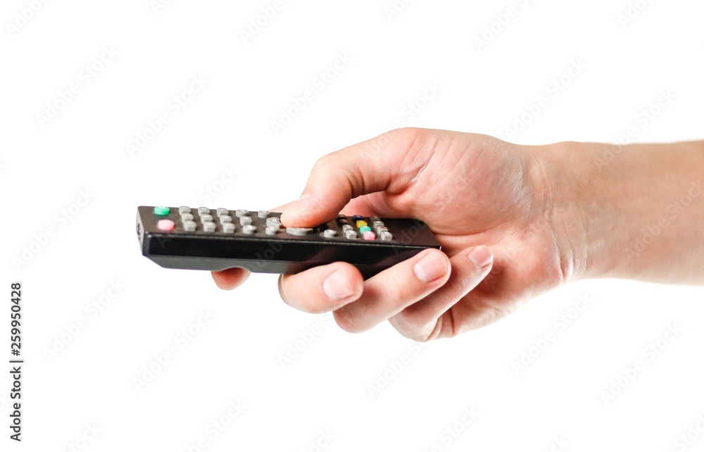 Hand holding the TV remote. Close up. Isolated on white background Hand holding the TV remote. Close up. Isolated on white background