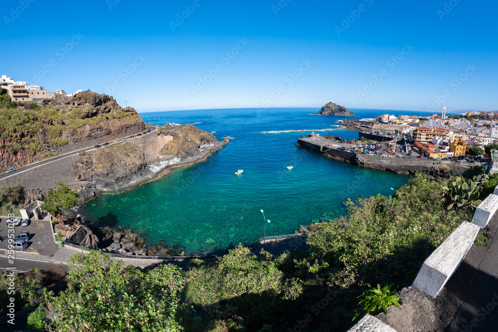 Wide panoramic view of Garachico village and habor in summertime, Tenerife island of Spain