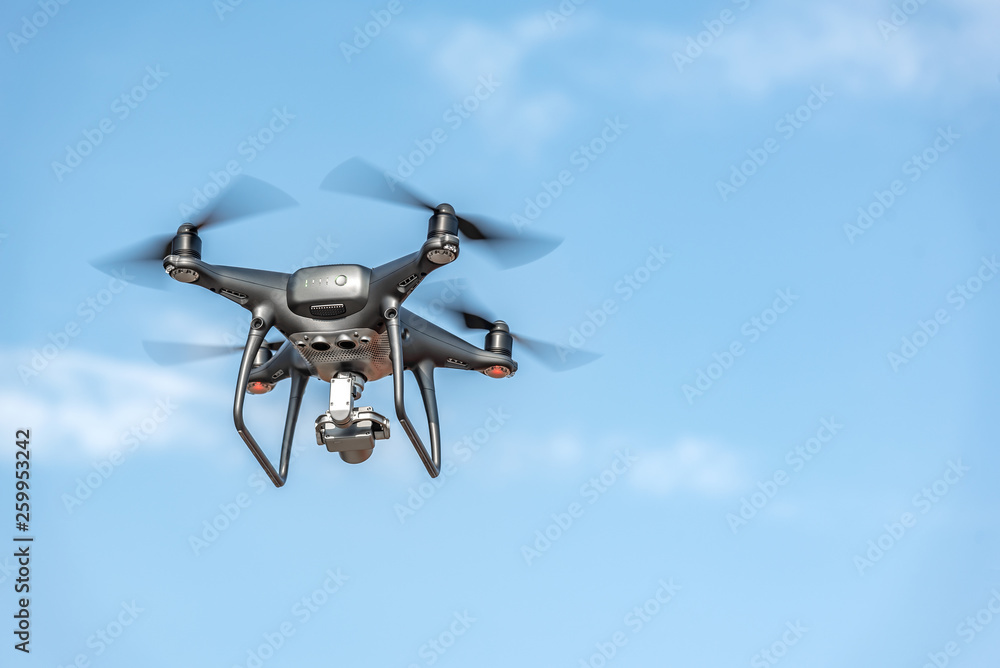 Drone in the sky. Unmanned aerial vehicle flying in the air. Drone in the sky. Unmanned aerial vehicle flying in the air.