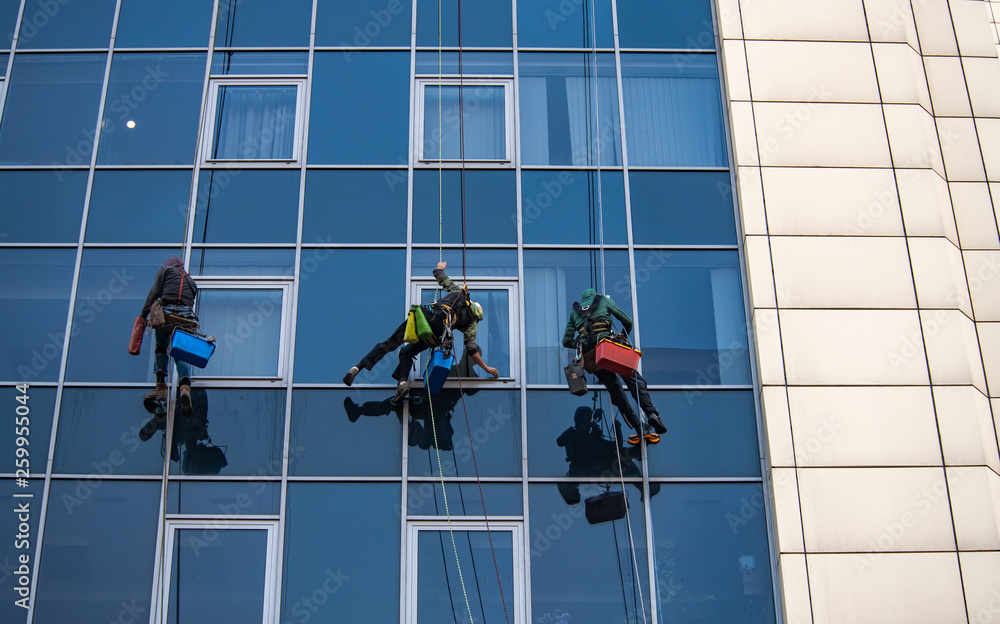 Glass clean man building tower work business