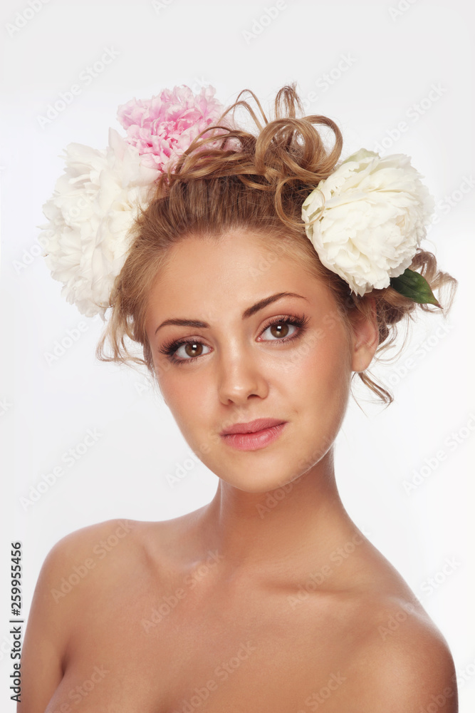 Young beautiful tanned girl with fancy hairdo