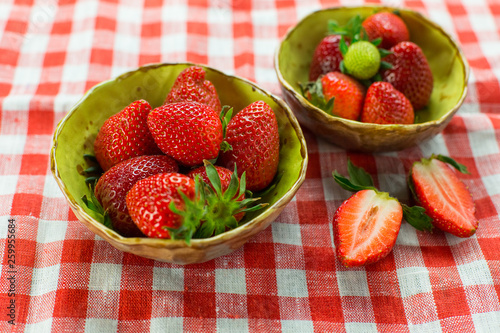 Strawberries on wooden background. Fresh vitamin organic berries