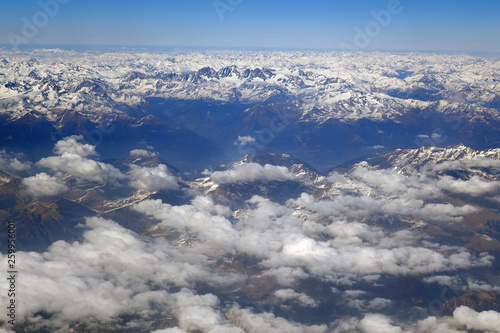 Alps mountains in spring, Italy. Aerial view from air plane