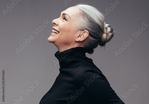 Senior woman looking happy photo