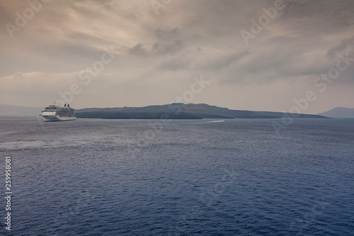 Panorama of Santorini on a cloudy day, with cruise ship waiting in the harbor © Gianluca