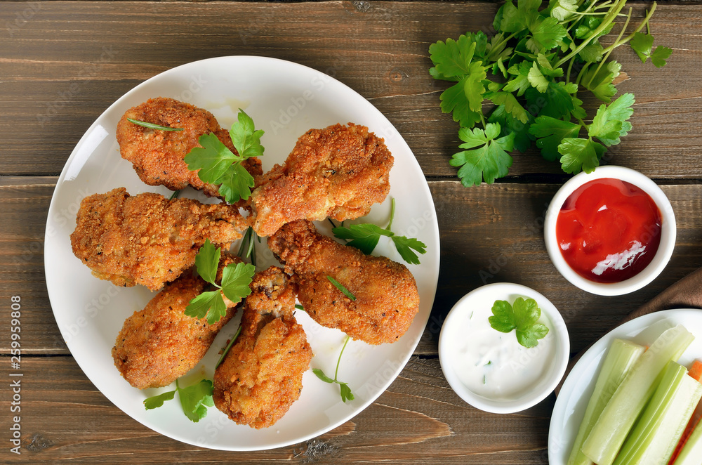 Grilled chicken wings, sauce and fresh parsley Grilled chicken wings, sauce and fresh parsley