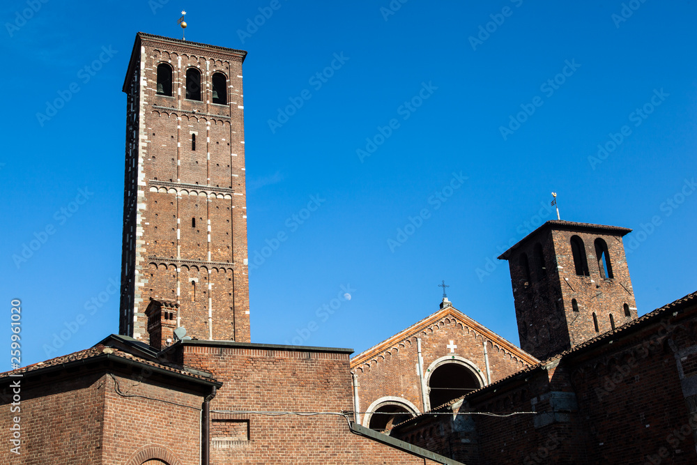 Chiesa di San'ambrogio in Milan on a sunny day, with columns and bell tower