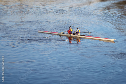 Rowing crew. Double scull rowing boat. Two rowers