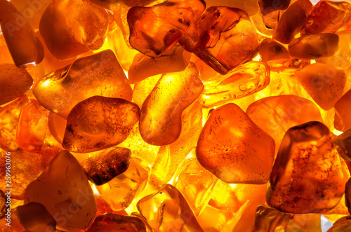closeup from little amber stones backlight - background