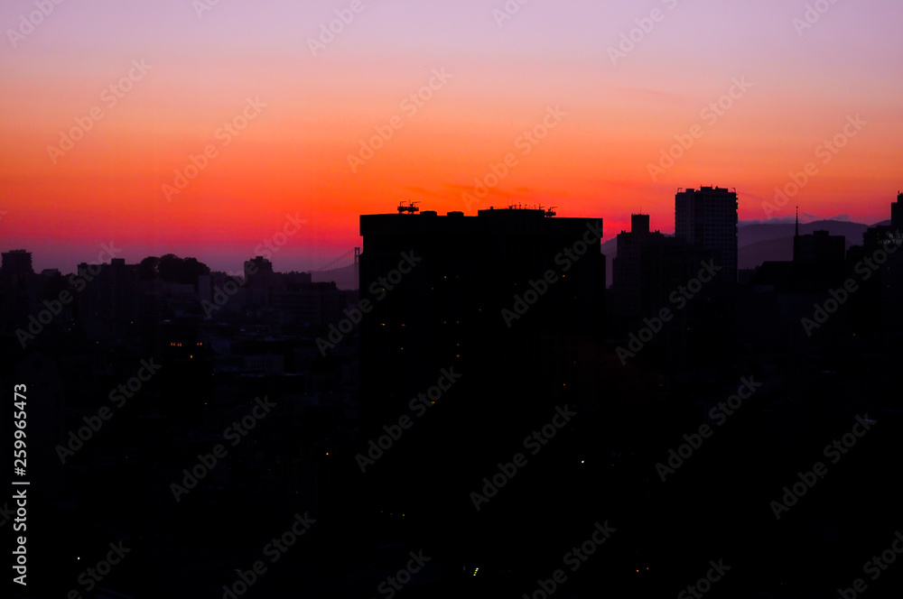 Urban city with tall buildings and sunset