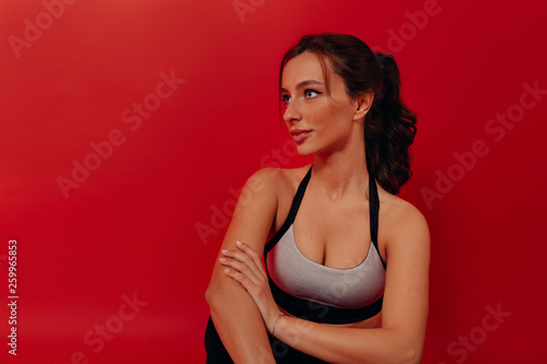 Wallpaper Mural Sport and healthy lifestyle. Attractive brunette woman wearing sports uniform preraring for training and gym Torontodigital.ca