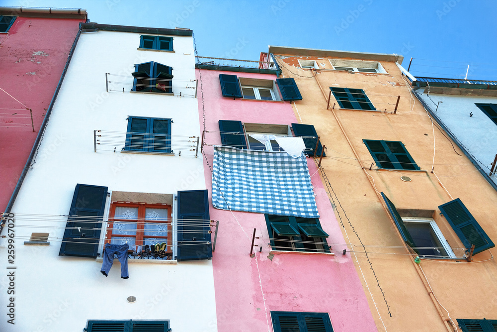 colored facade of houses on the seafront of Portovenere in Italy in perspective