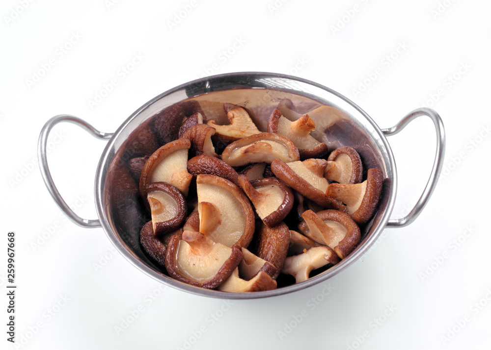 fried shiitake mushrooms in metal bowl isolated on white background fried shiitake mushrooms in metal bowl isolated on white background