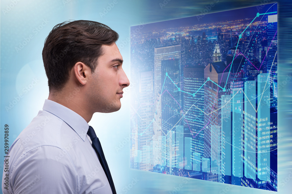 Businessman in futuristic stock trading concept Businessman in futuristic stock trading concept