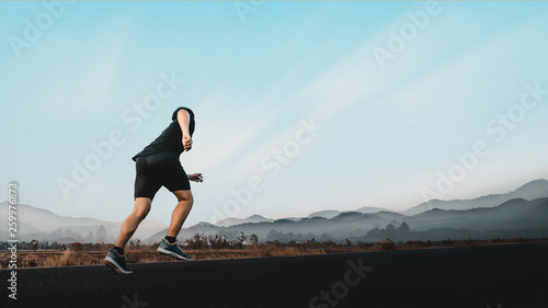 Young man enjoy running outside with beautiful summer evening in the countryside.