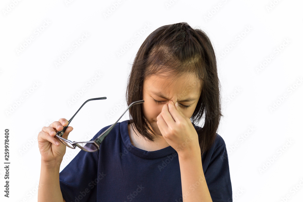 Asian little girl holding eyeglasses and massaging nose bridge rubbing her eyes,cute child feeling discomfort and fatigue ,isolated on white background,Sore eye,Eye fatigue, stress concept Asian little girl holding eyeglasses and massaging nose bridge rubbing her eyes,cute child feeling discomfort and fatigue ,isolated on white background,Sore eye,Eye fatigue, stress concept
