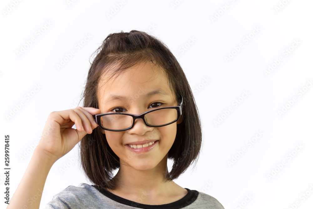 Asian little girl wearing eyeglasses isolated on white background,portrait of cute child holding glasses with hand and smiling,looking at the camera Asian little girl wearing eyeglasses isolated on white background,portrait of cute child holding glasses with hand and smiling,looking at the camera