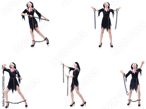 Young beautiful nun with shackles isolated on white