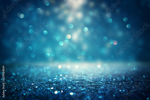 glitter vintage lights background. black and blue. de-focused