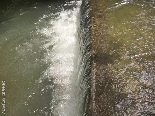 Water flowing over a wall