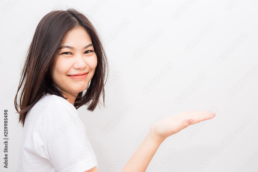 Beautiful asian wellness smiling women show welcome hand sign Beautiful asian wellness smiling women show welcome hand sign