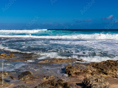 Hawaiian beach with blue waves