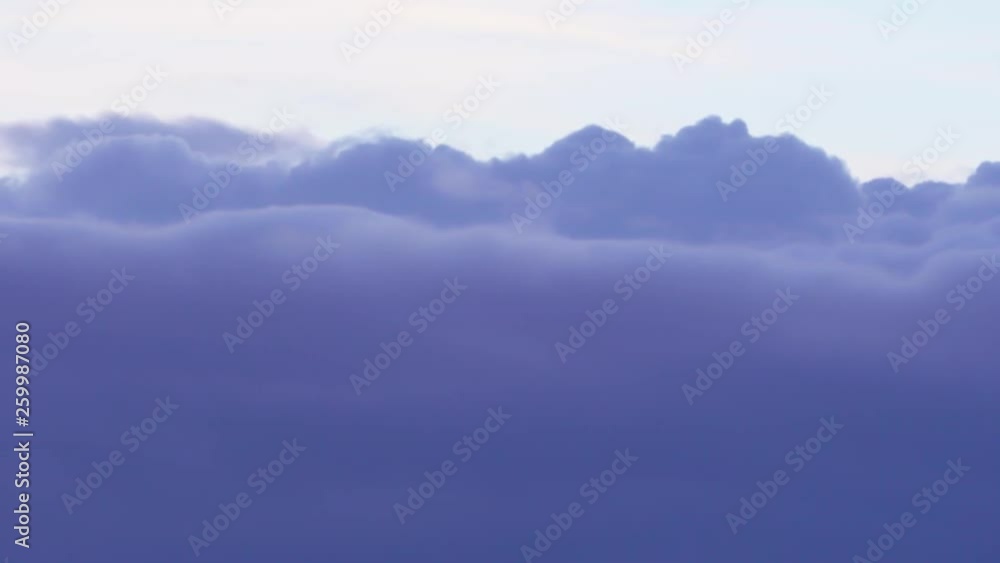 Flying through the light blue, puffy fluffy clouds. view from the plane. 3840x2160 Ultra HD stock footage. Flying through the light blue, puffy fluffy clouds. view from the plane. 3840x2160 Ultra HD stock footage.