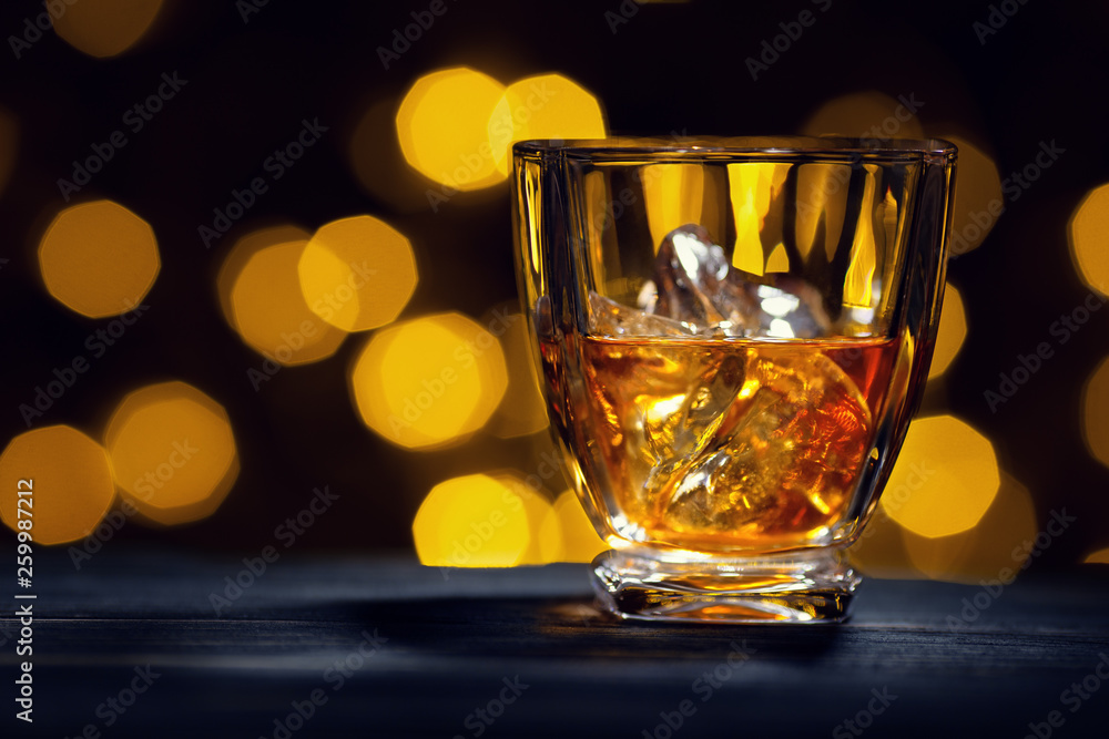 whiskey with ice cubes in glass whiskey with ice cubes in glass