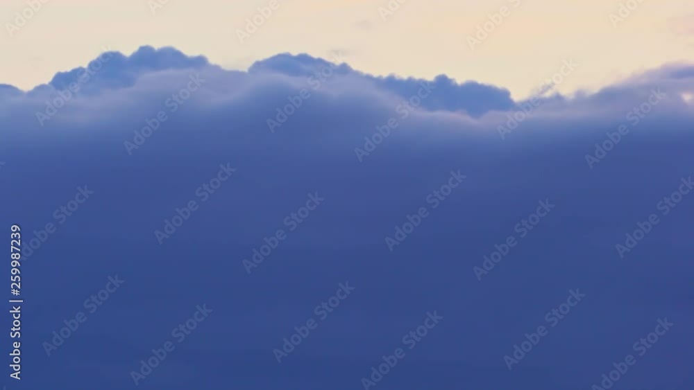 4K Time lapse of the evening sky, dark blue puffy fluffy clouds quickly rush past. Golden sun. Sunset. Ultra HD stock footage. 4K Time lapse of the evening sky, dark blue puffy fluffy clouds quickly rush past. Golden sun. Sunset. Ultra HD stock footage.