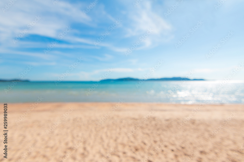 Abstract background blurry scenic of summer sand beach and cloudy blue sky Abstract background blurry scenic of summer sand beach and cloudy blue sky