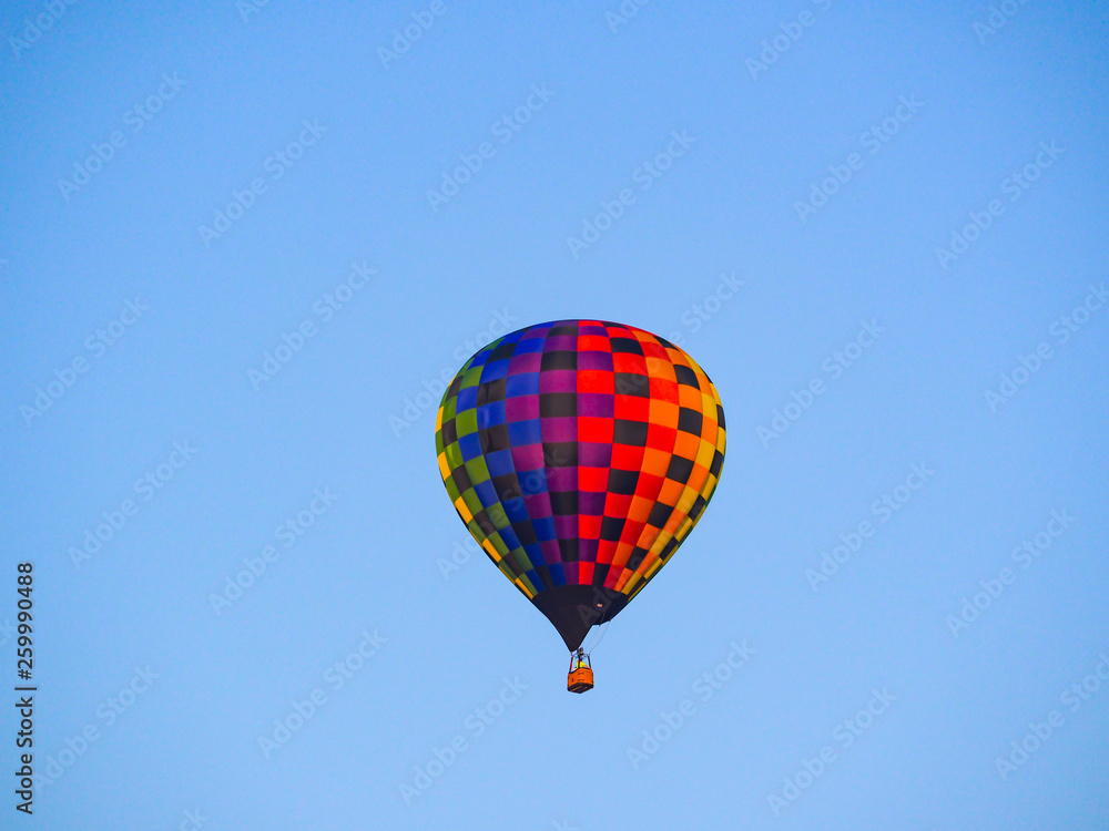 Fototapeta premium Colorful Hot Air Balloon Floating Blue Sky