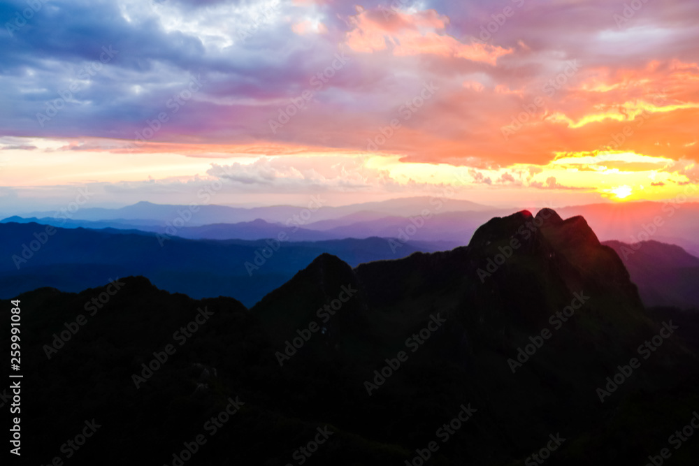 Silhouette sunset on mountain with colorful sky cloud