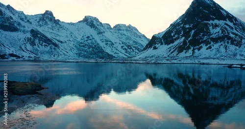 Aerial view over the water with reflection from the mountians of the Lofoten Islands, Norway