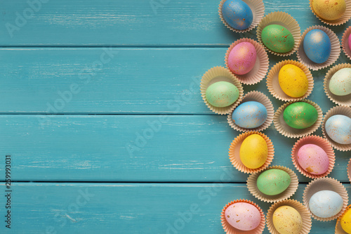 Easter background. Colored eggs, top view