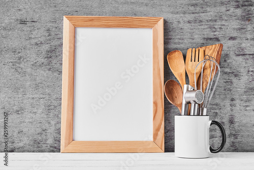 Kitchen utensils and white blank with copy space
